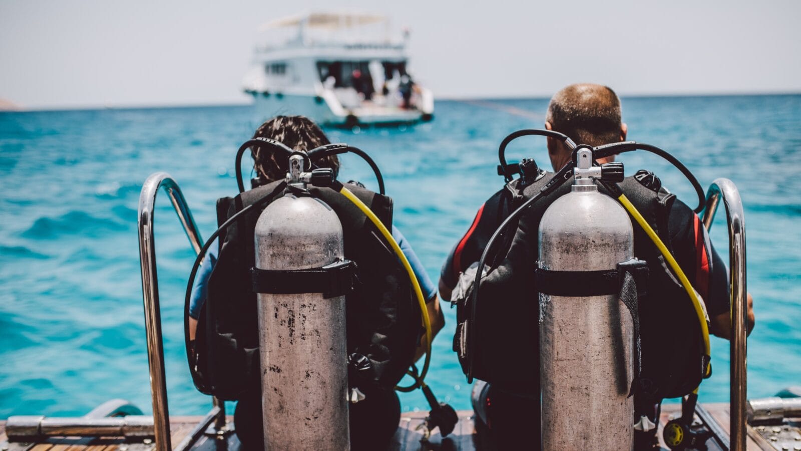Scuba Divers in front of a boat