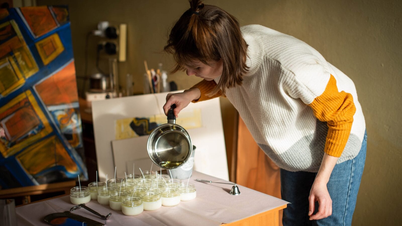 Woman making candles