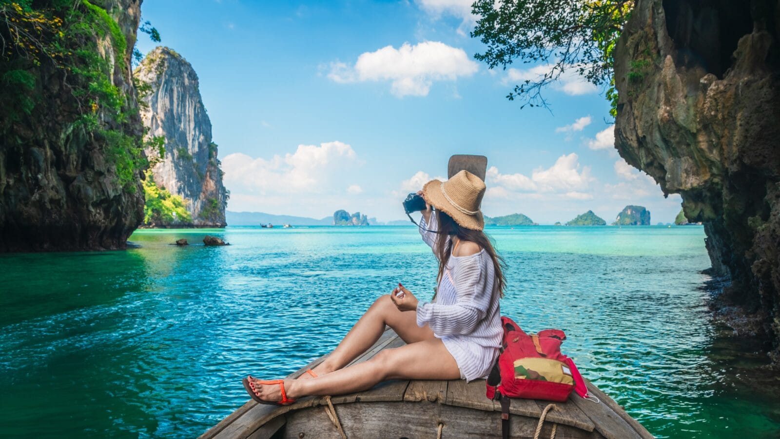 Woman taking a picture in Phuket, Thailand.