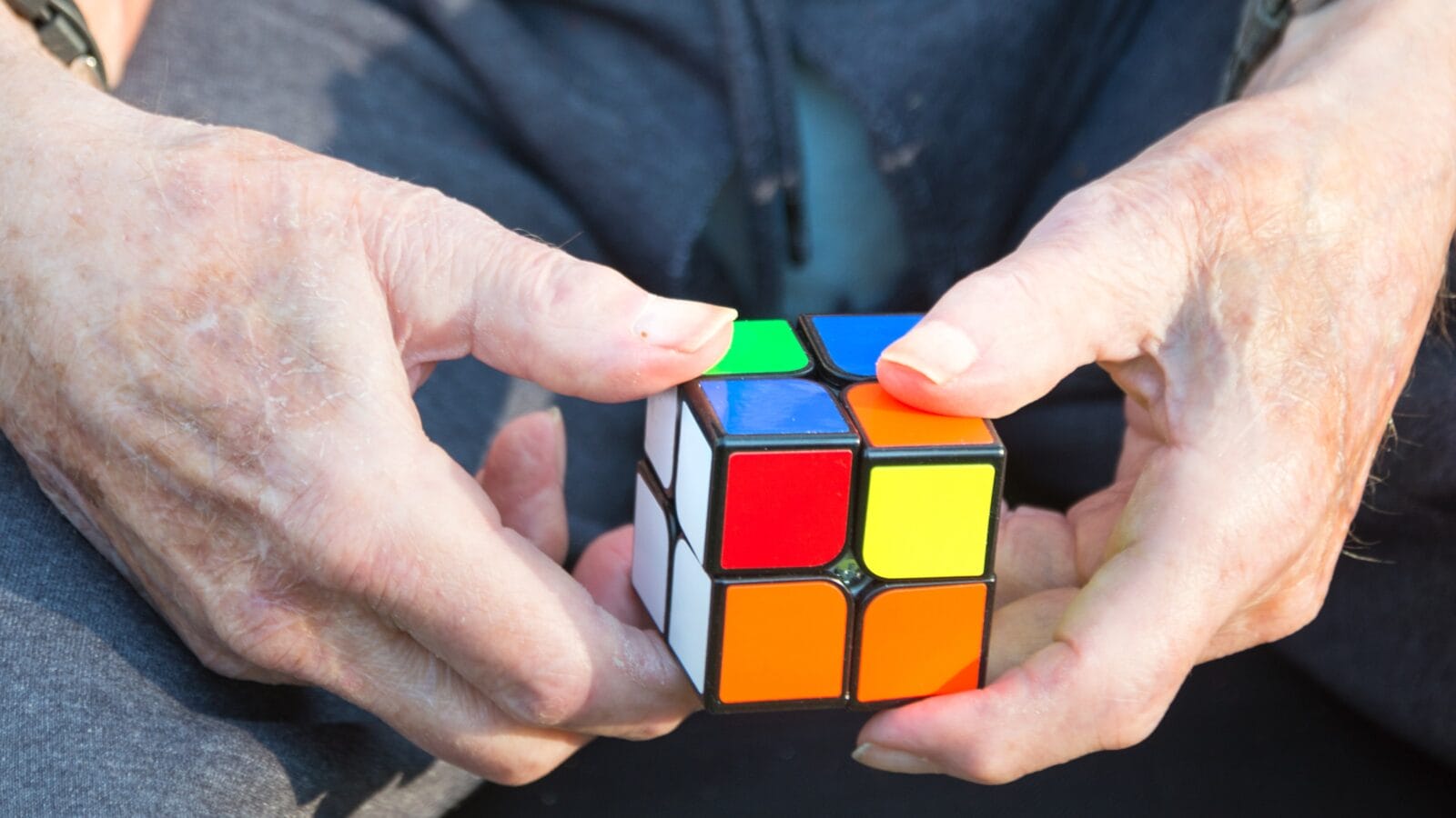 Man solving a Rubix Cube