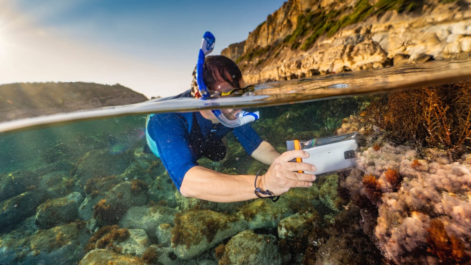 A snorkeler taking a picture.