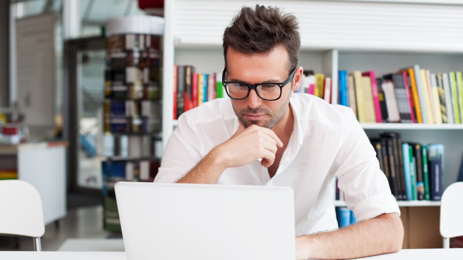 Man on a laptop.