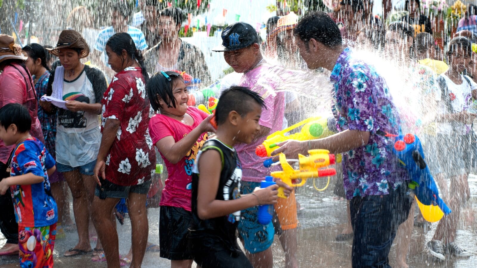 AYUTTAYA,THAILAND-APRIL 13: unidentified People celebrating Songkran (Thai new year / water festival) child and his water gun on road April 13, 2012 in Ayuttaya, Thailand.