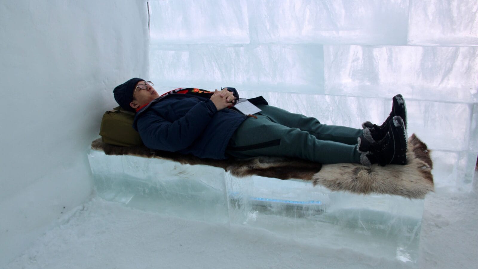 A man lying on an ice bed