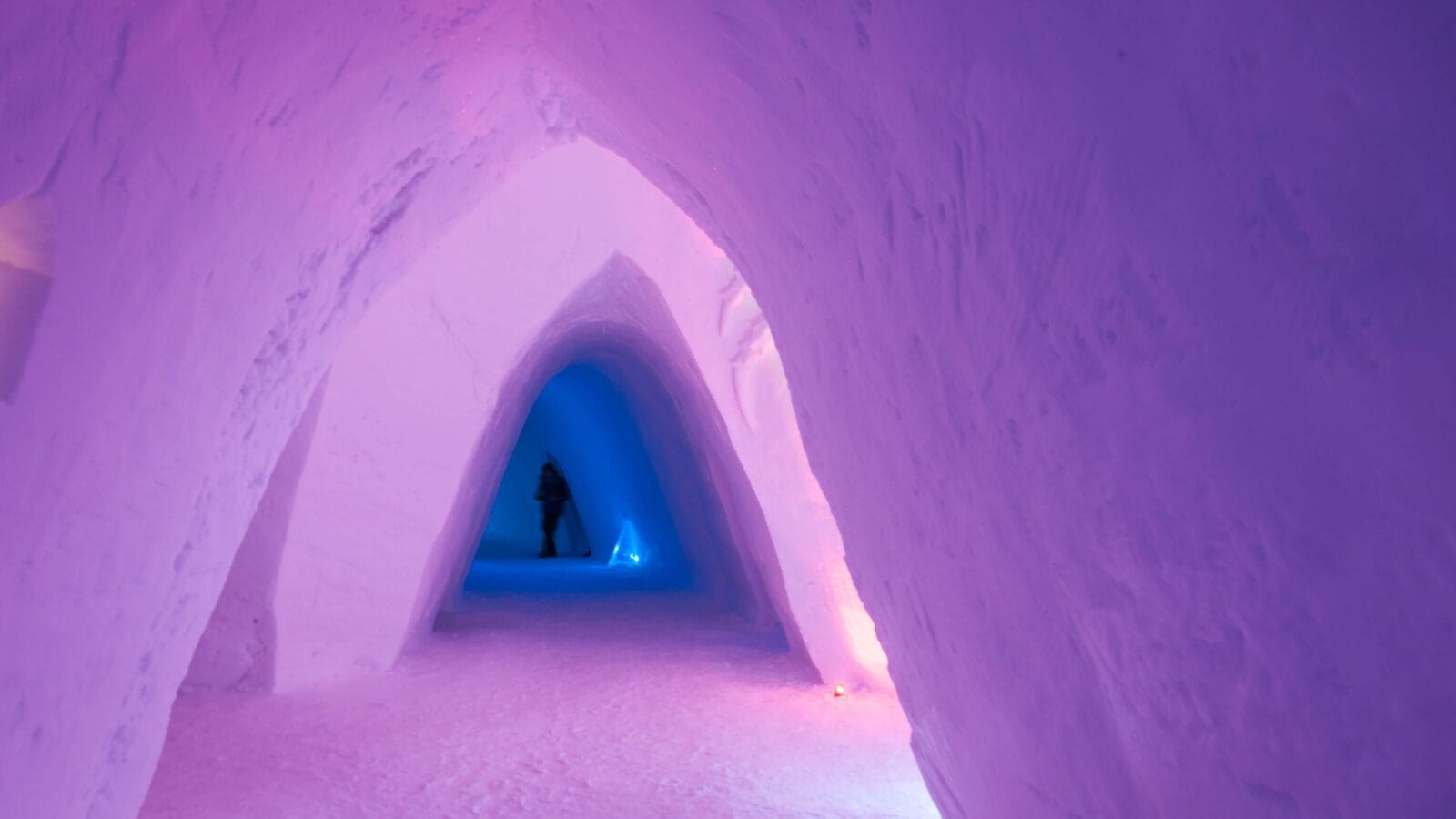 Colorful pink entrance made of ice at the Snow Hotel, Kirkenes, Norway