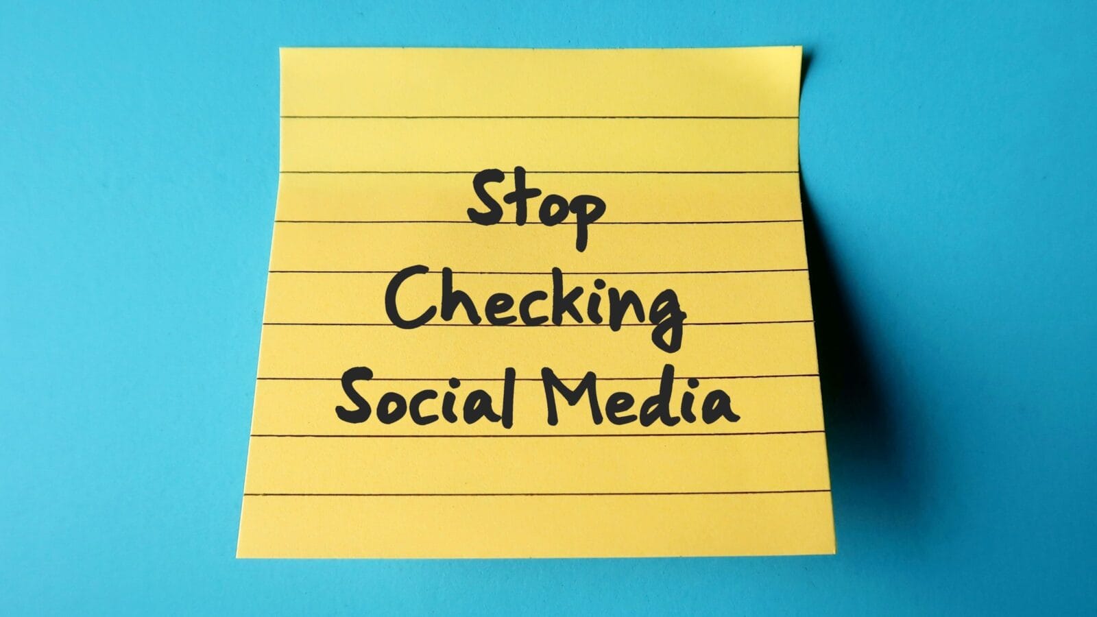 On blue background, handwritten stick note