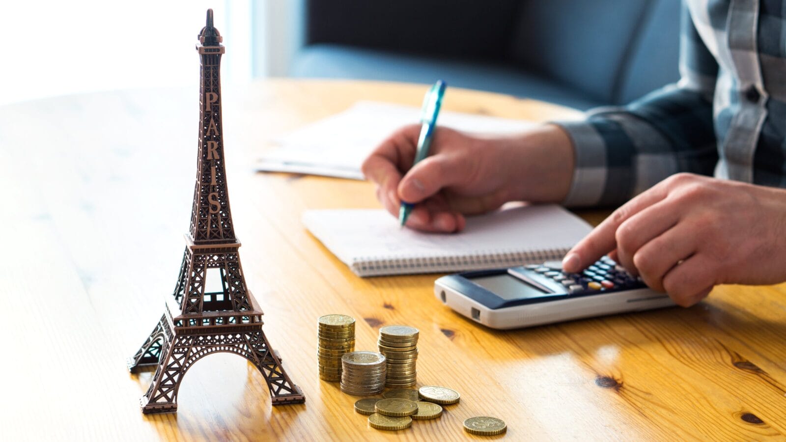 Man counting travel budget, vacation expenses or insurance cost.