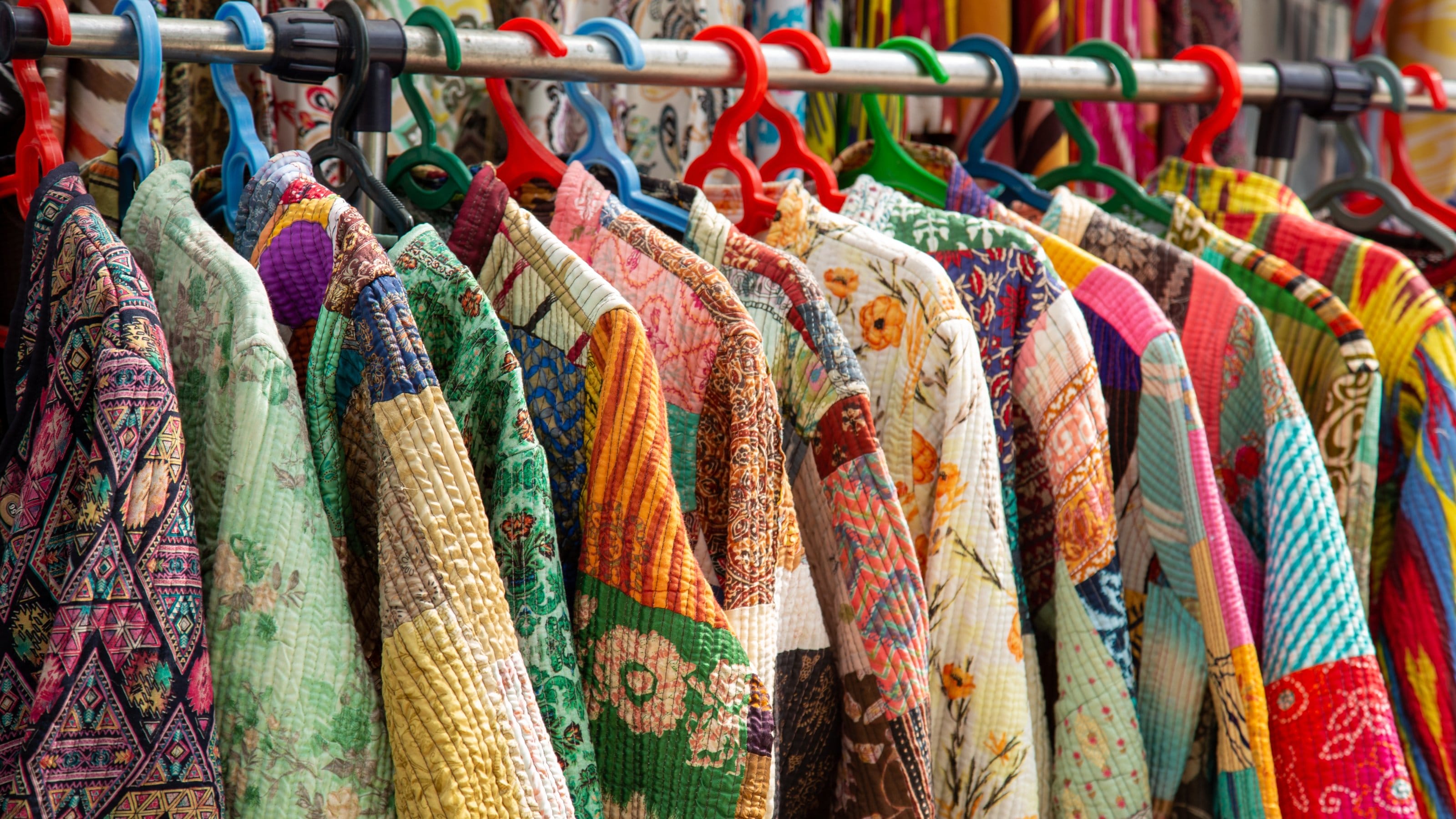 Different kind of colorful clothes on a market.