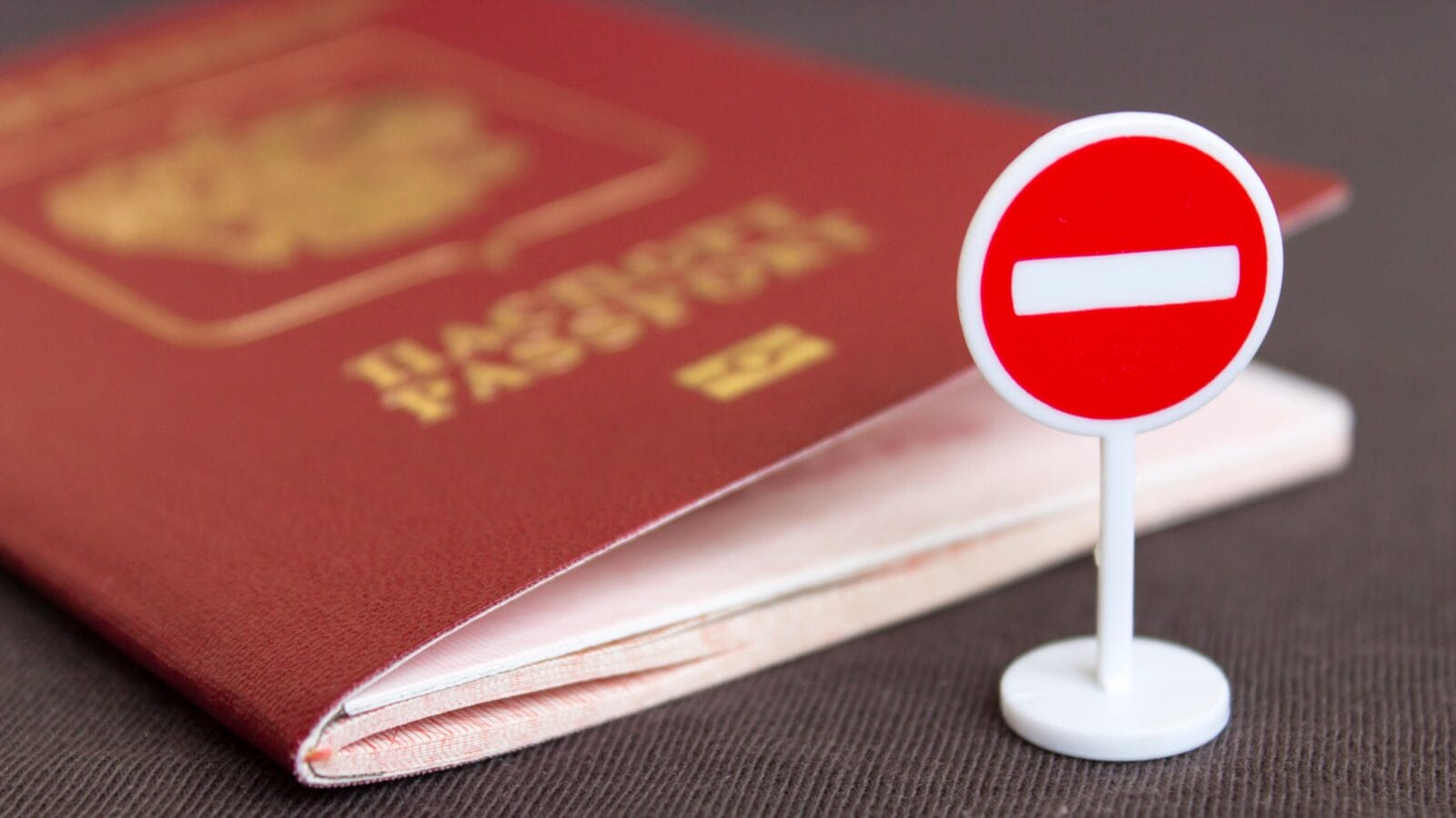A passport and a stop sign.