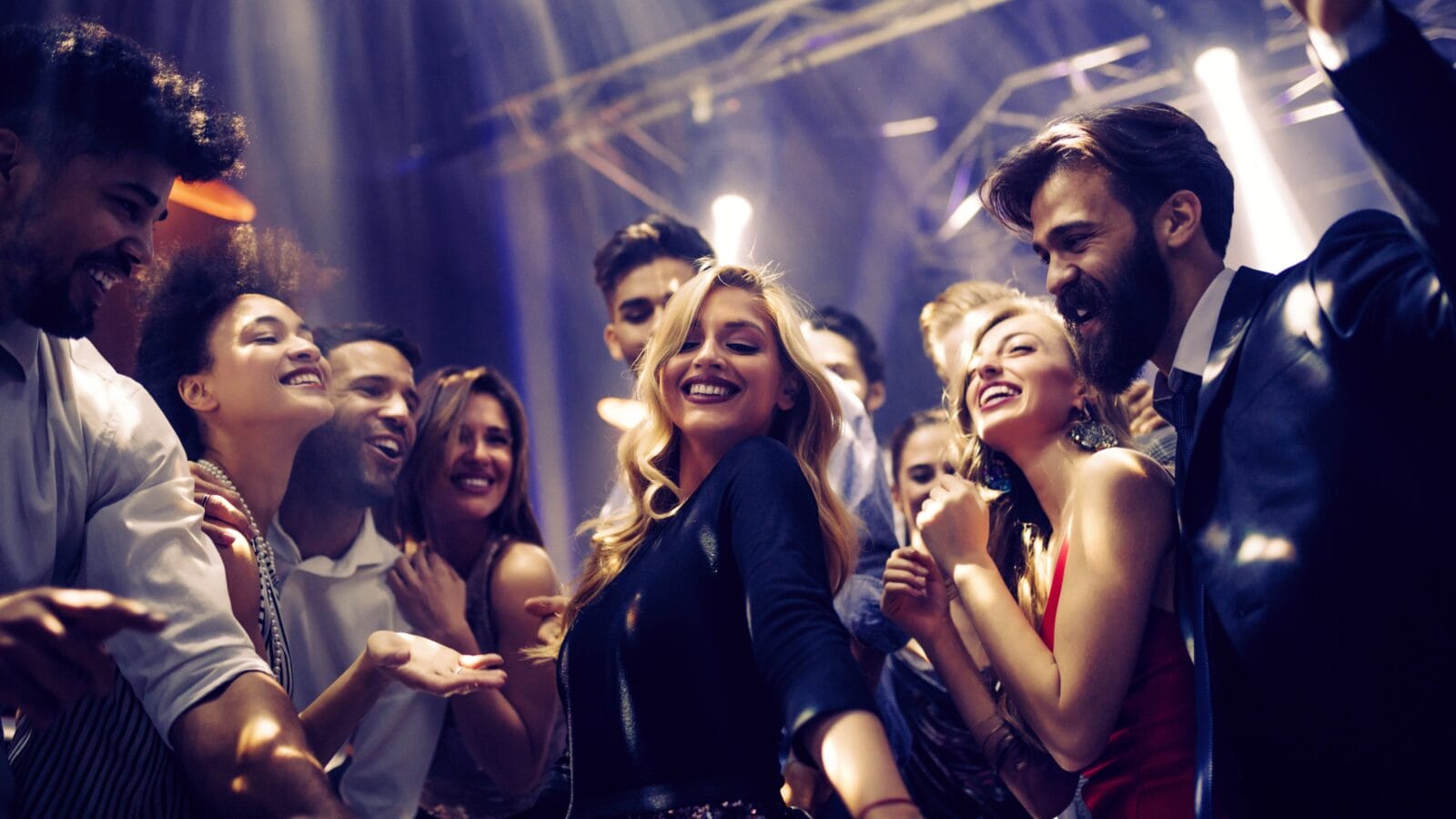 Shot of a young woman dancing with friends