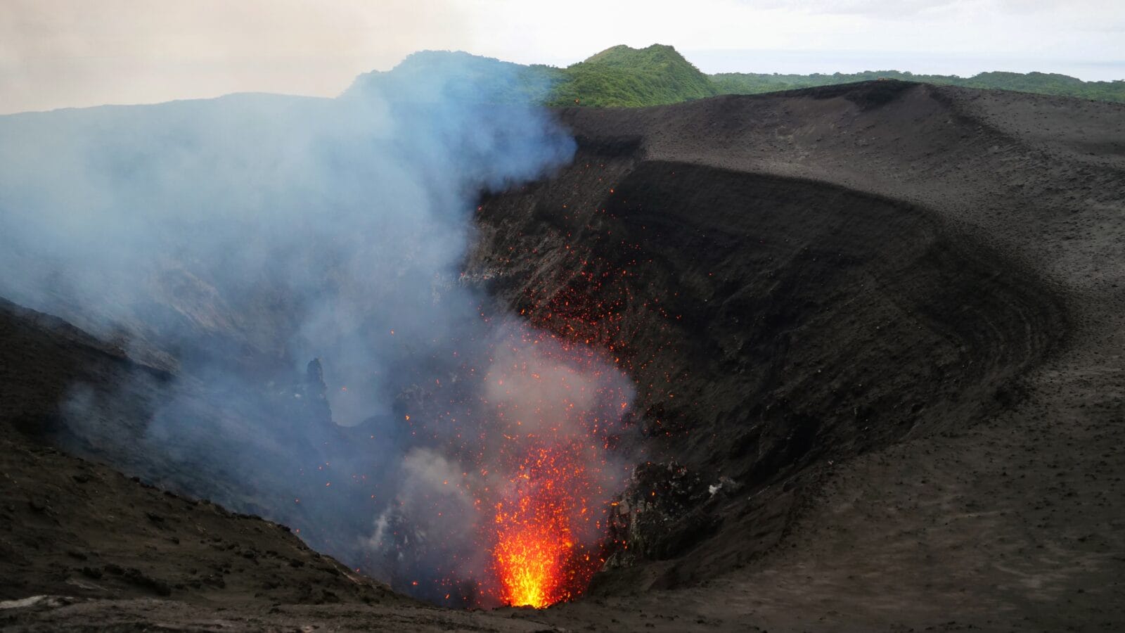 Mount Yasur exploding and belching out hot pieces of magma.