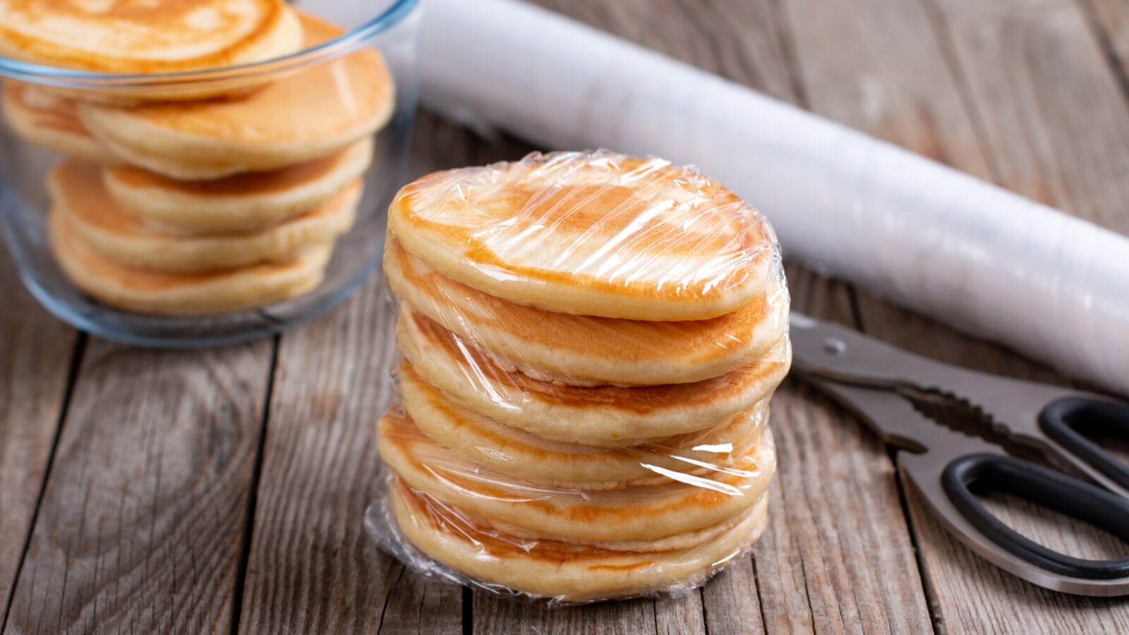 Frozen pancakes on a wooden table.
