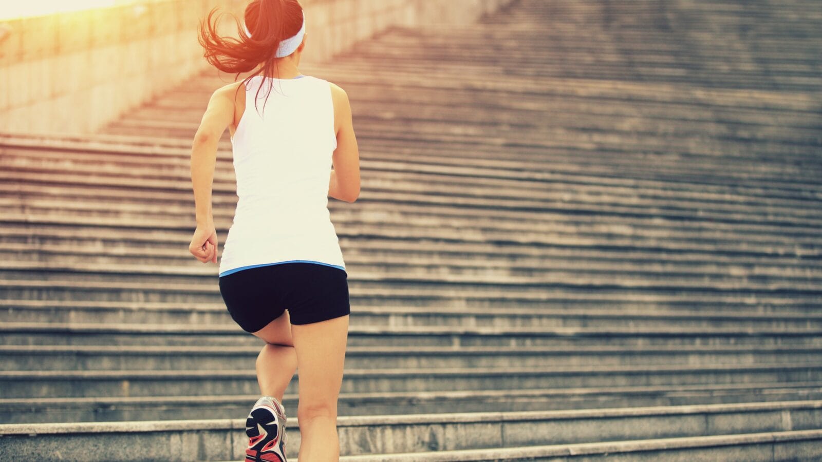 A womman running on stairs.
