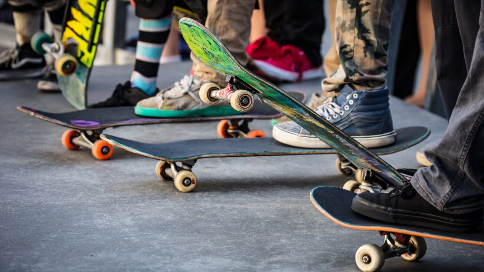 A group of friends with skateboards.