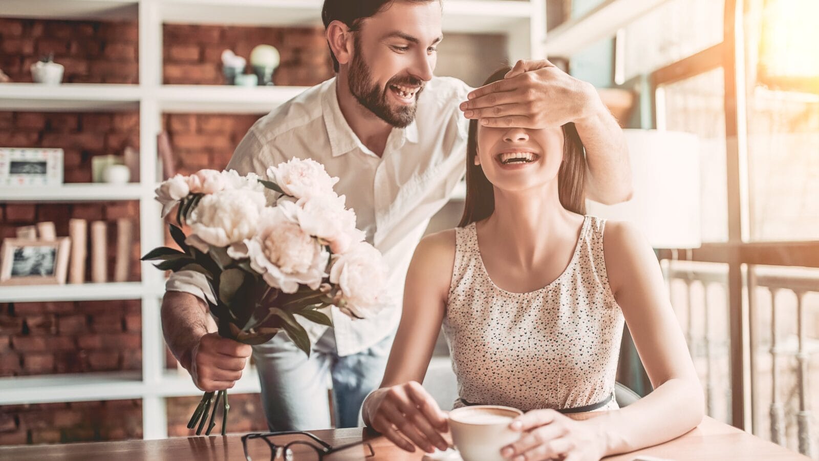 A man giving flowers to his woman.