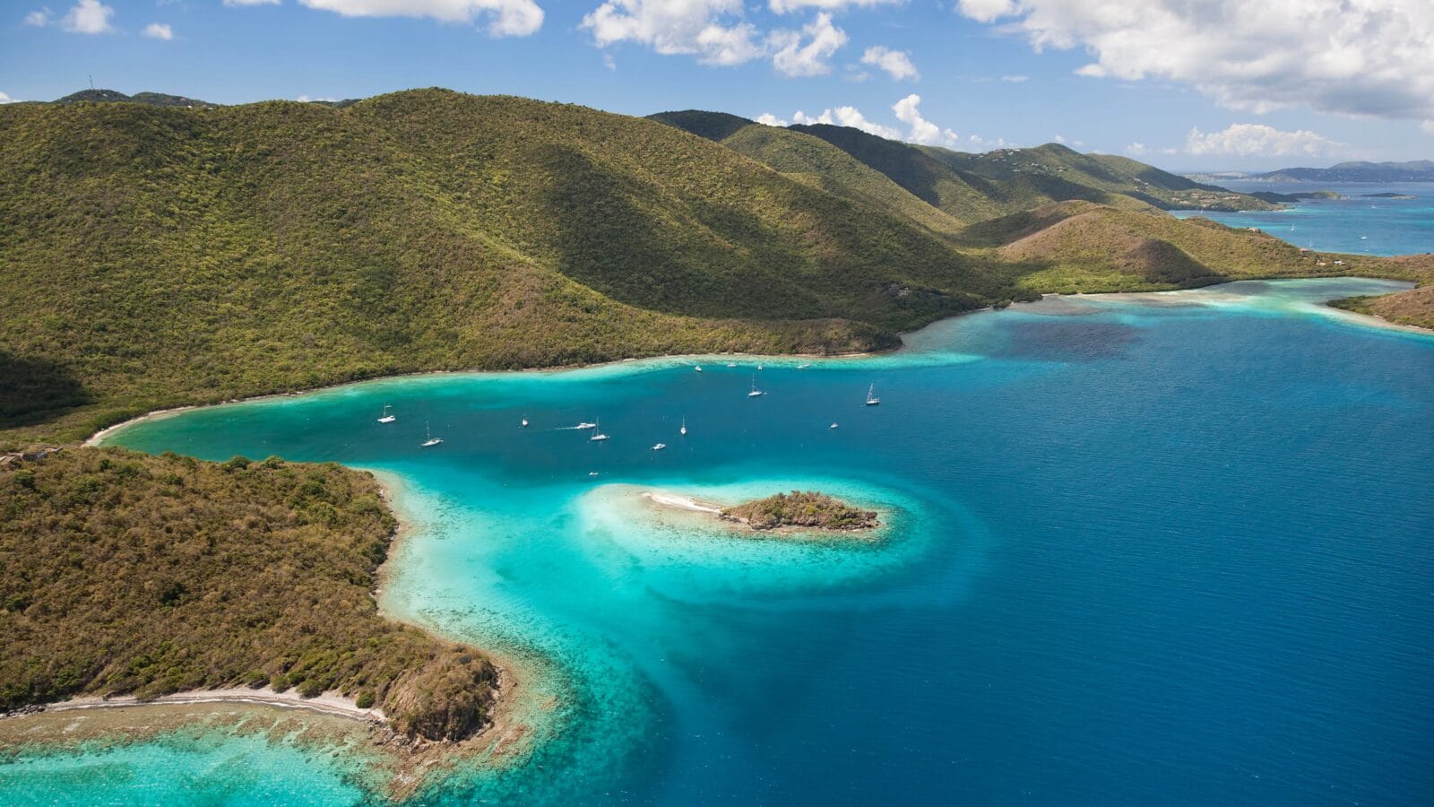 Aerial view of Waterlemon Cay with the North Shore of St. John in the distance in the U.S. Virgin Islands National Park.