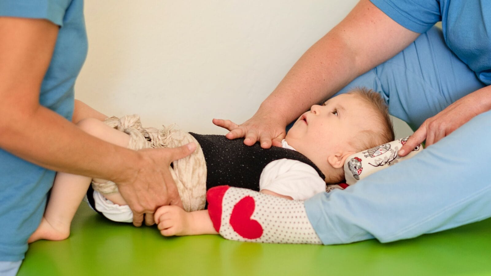 A baby with cerebral palsy on physiotherapy in a children therapy center.