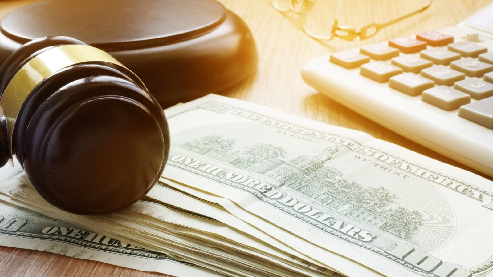 Bail bond concept. Gavel and dollar banknotes.