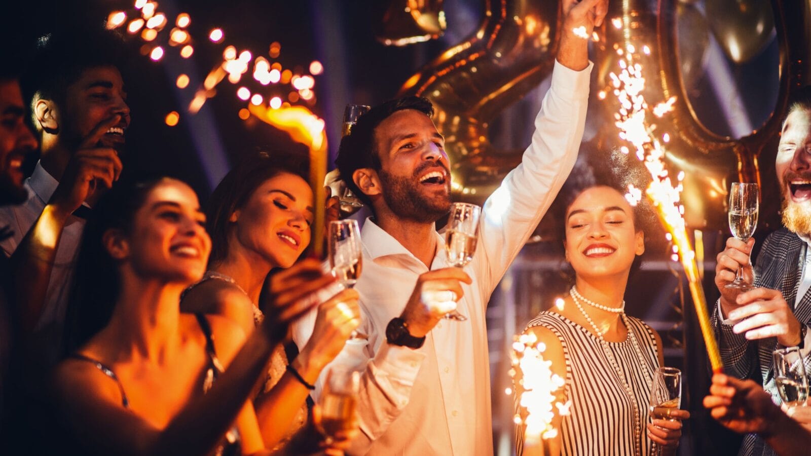 Group of friends celebrating with champagne