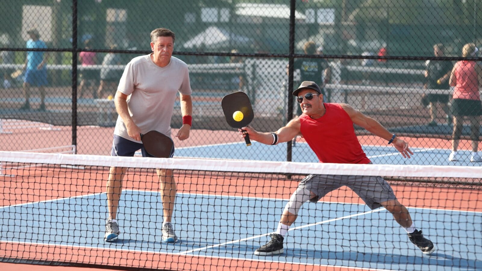 A senior doubles team competes in a pickleball tournament