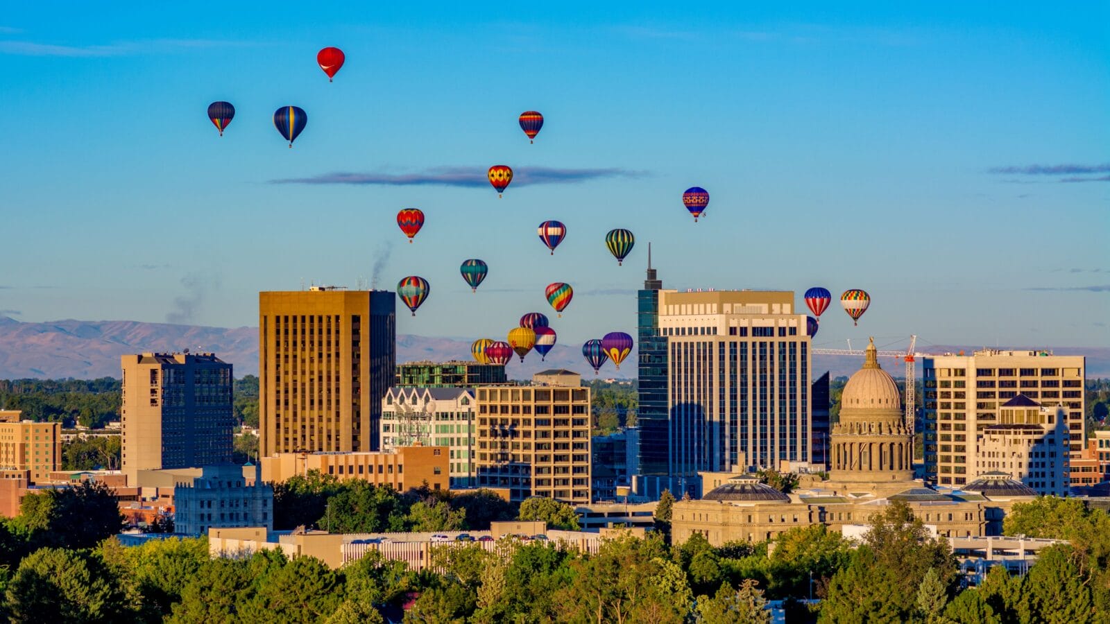 Capital and skyline of Boise Idaho with balloons in flight
