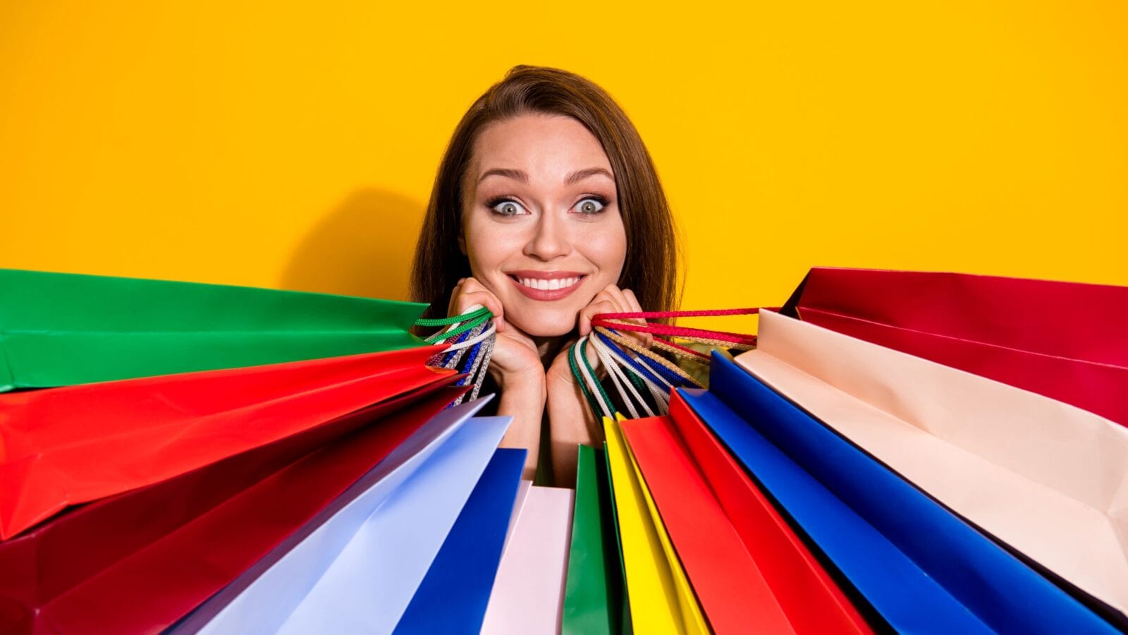Photo of charming funny pretty lady good mood hold many shopping bags
