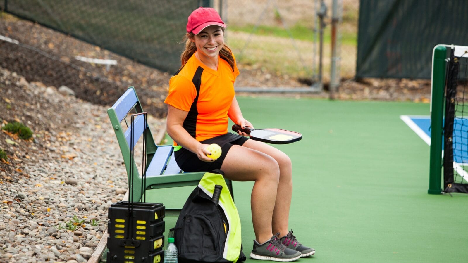 Female Pickleball player getting ready for her match
