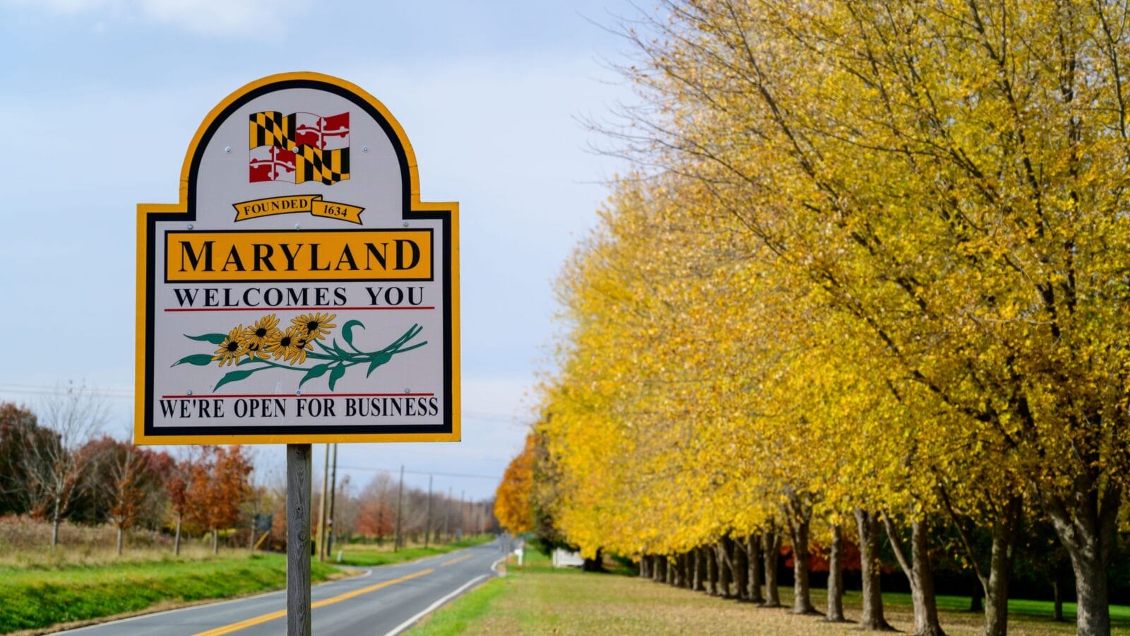 Welcome to Maryland sign with yellow trees