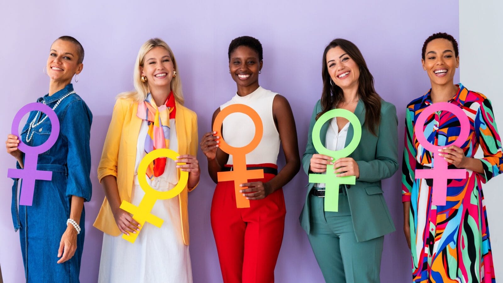 Group of beautiful confident women holding the femininity Venus symbol to celebrate women's day