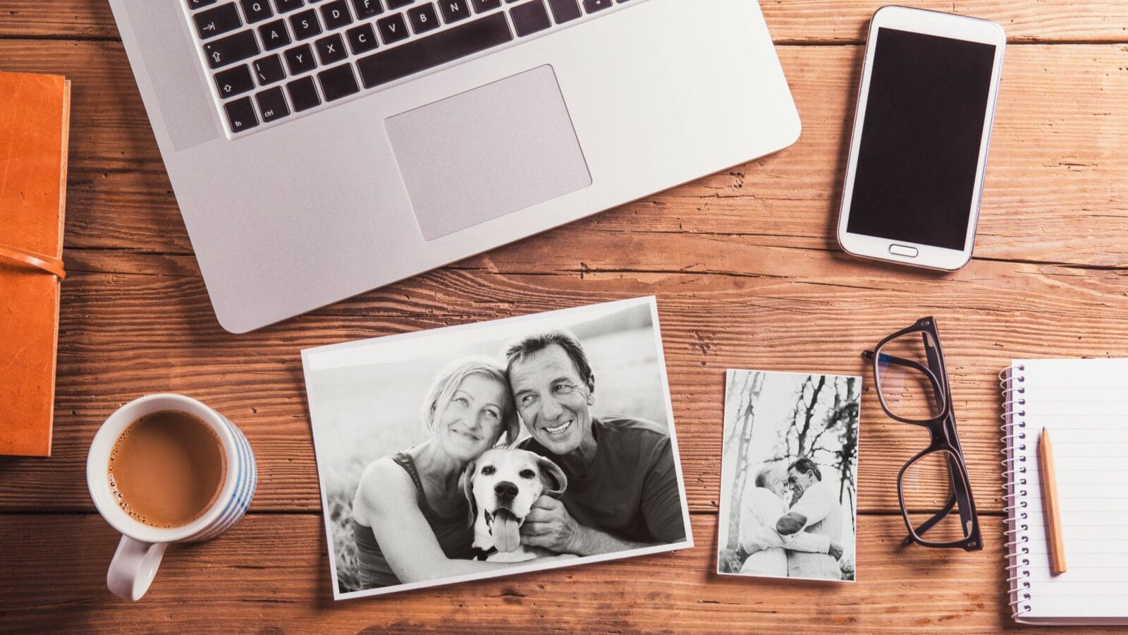 Office desk. Objects and black-and-white photos of senior couple