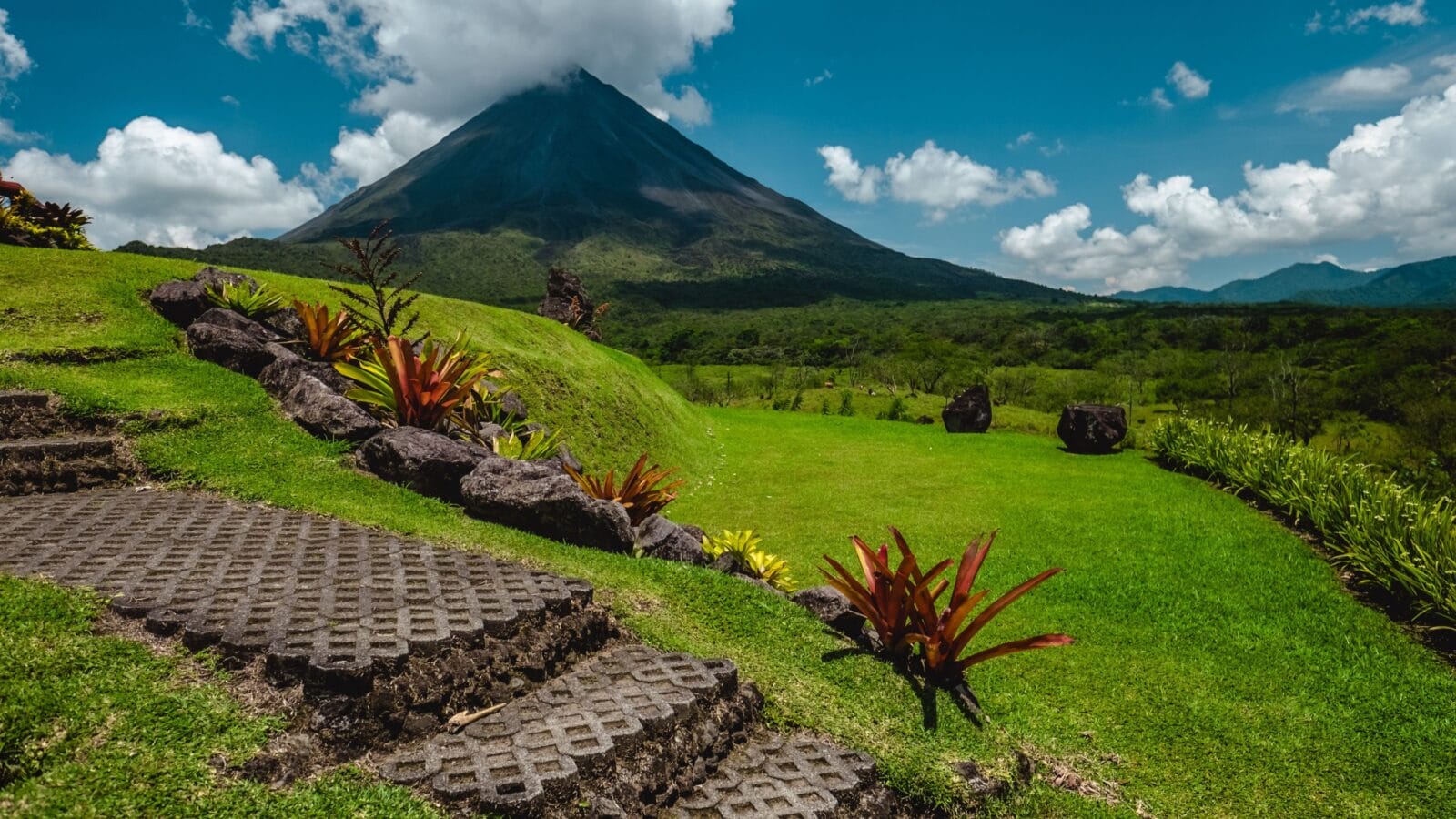 Volcano of Arenal with stone stairs on the foreground at sunny day. Costa Rica