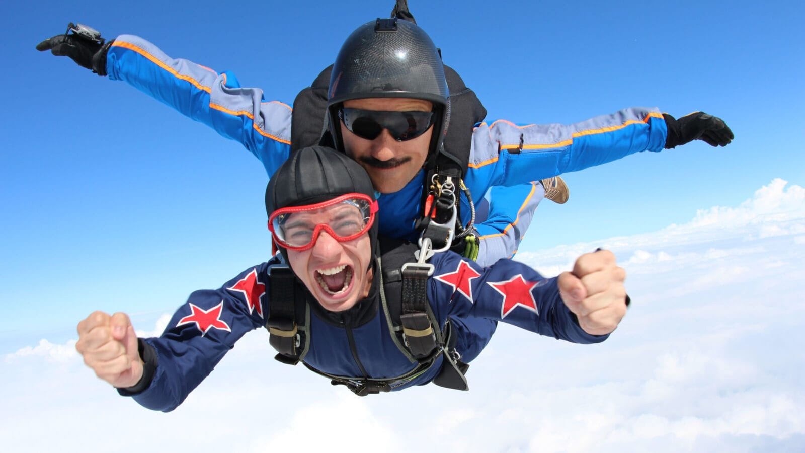 Skydiving. Tandem passenger is very happy