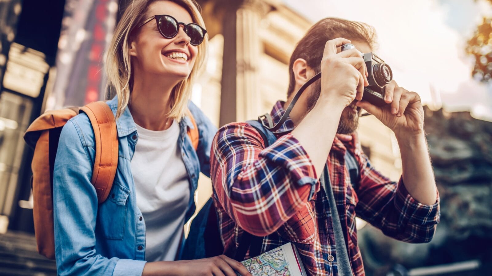 Couple of tourists is exploring new city together