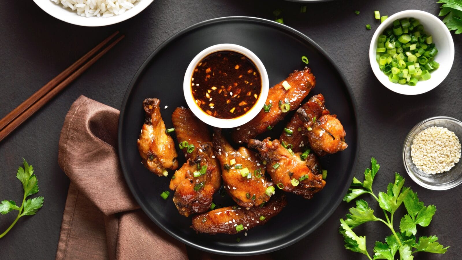 Sticky honey-soy chicken wings on plate