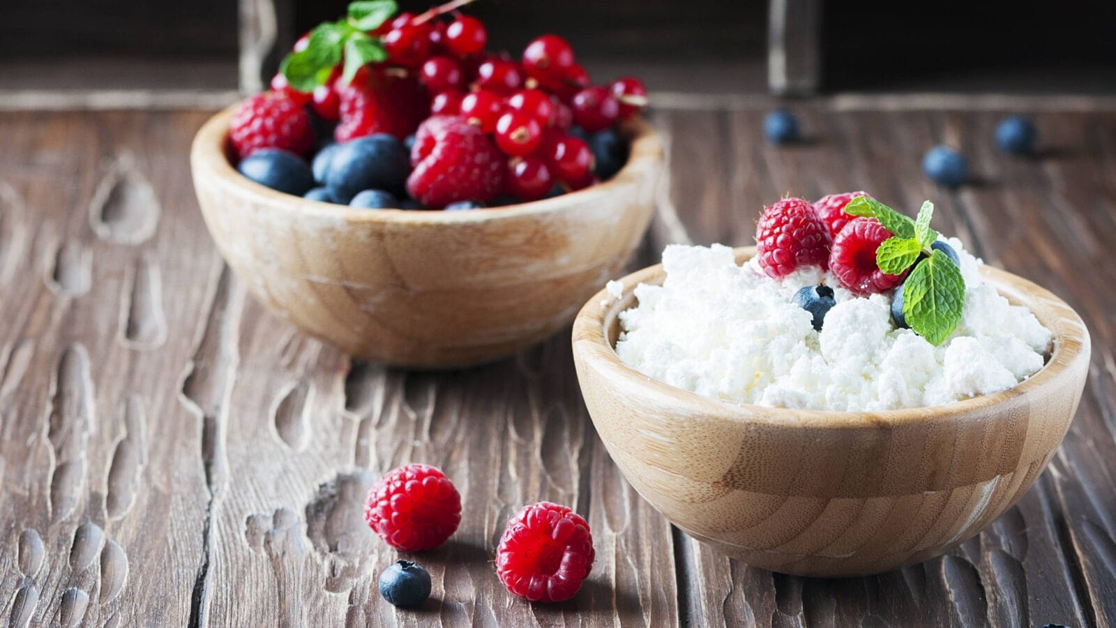 Russian cottage cheese with berry and mint, selective focus