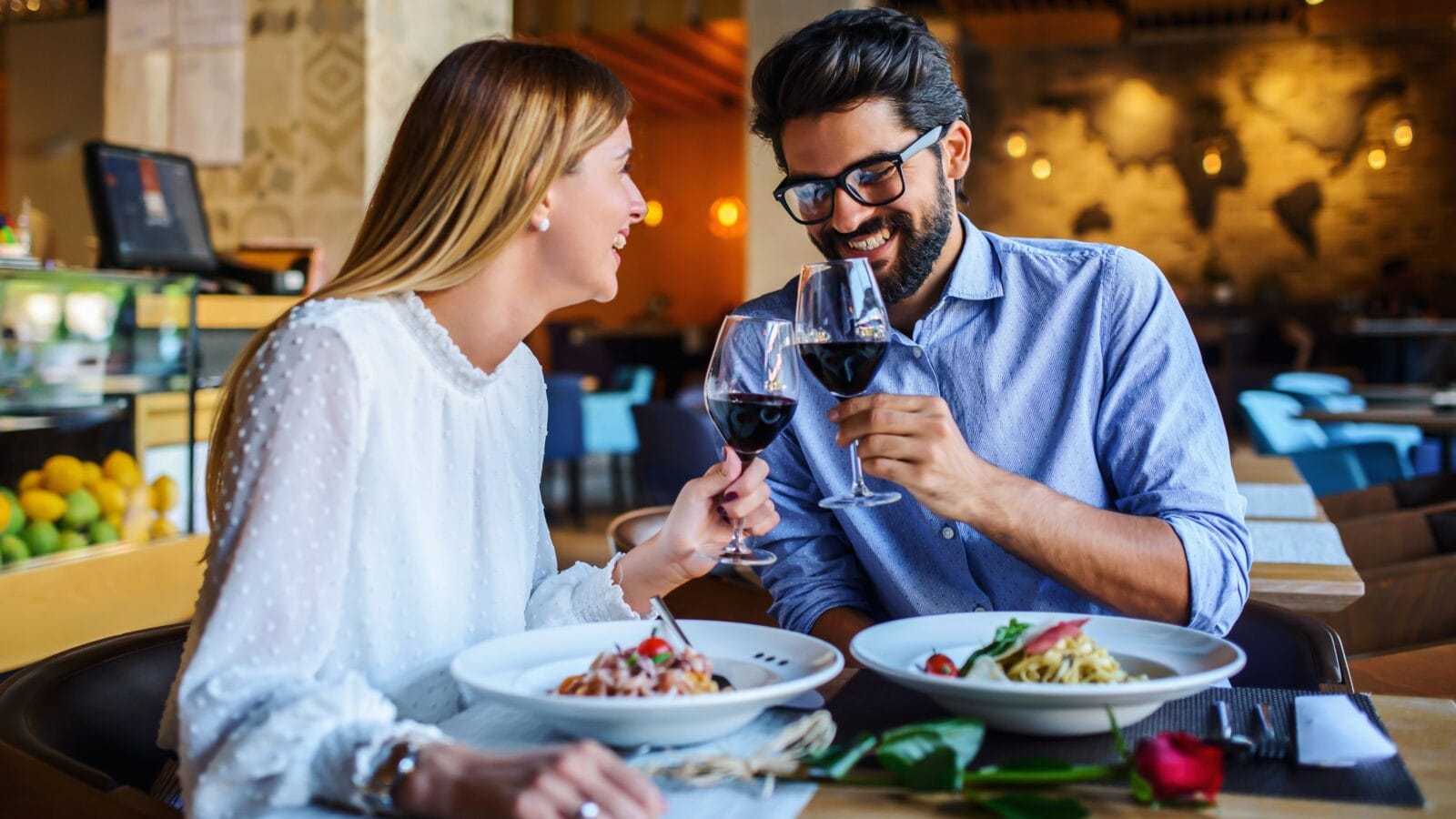 Loving couple enjoying lunch in the restaurant