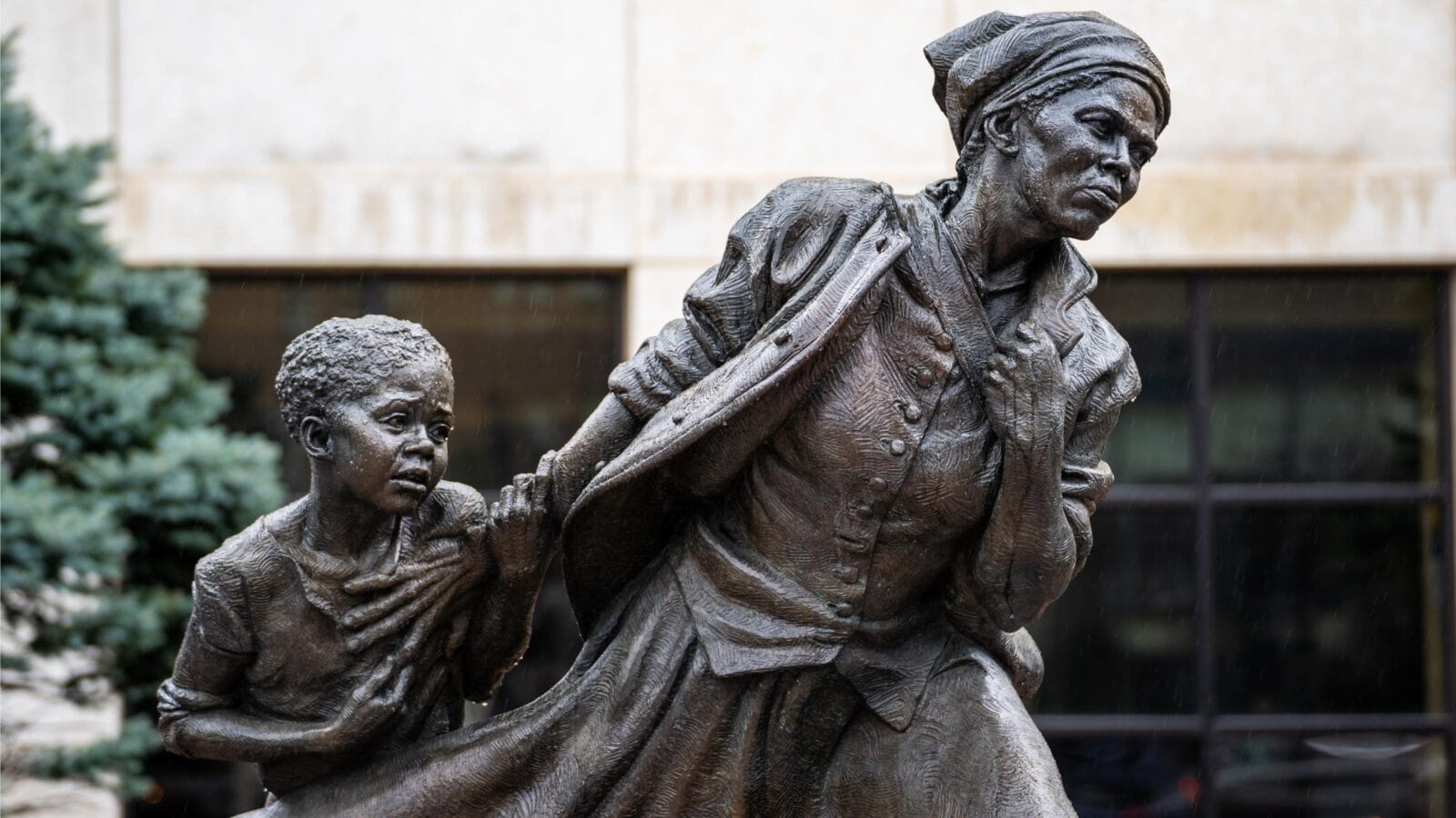 Depicting Tubman leading a young enslaved girl to freedom.