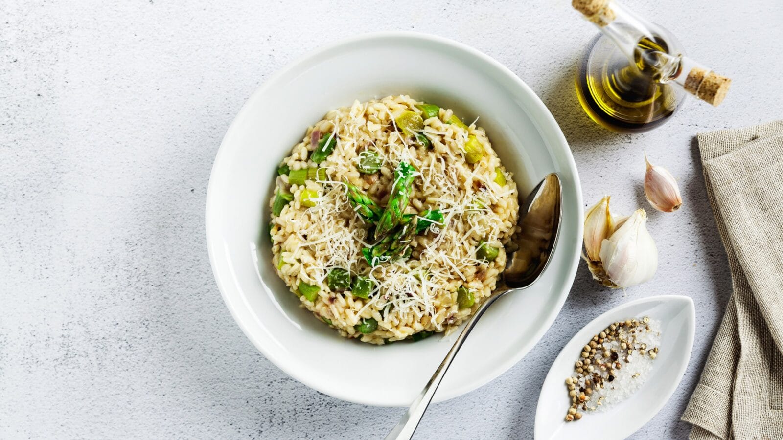 Italian risotto with spring fresh asparagus, parmesan cheese and garlic
