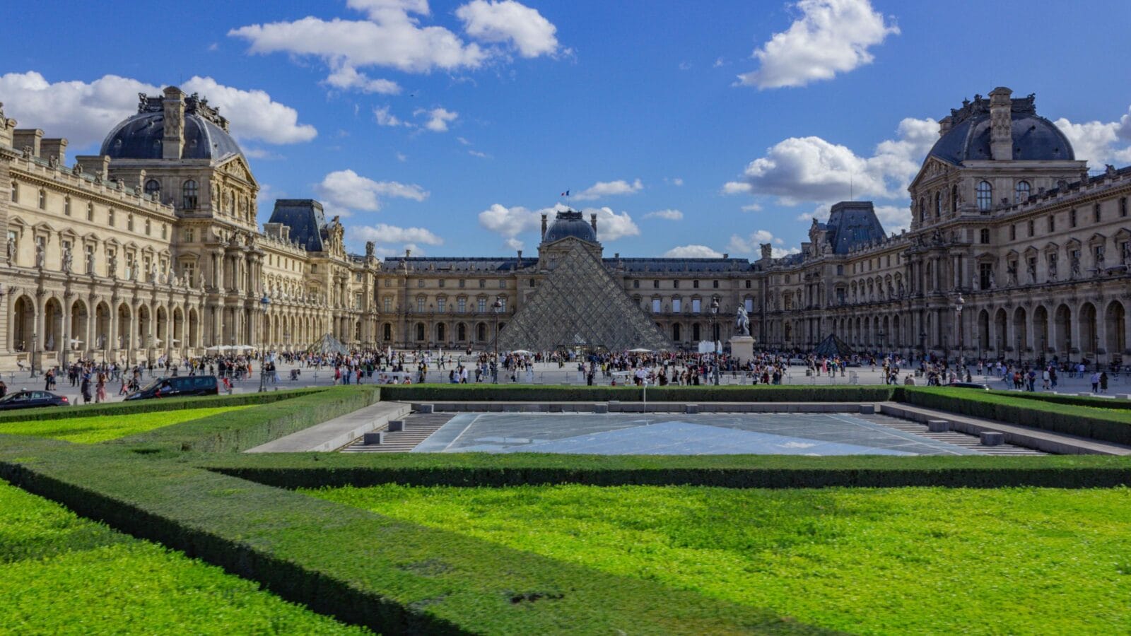 A scenic view of the Louvre Museum at the heart of Paris, France in daylight