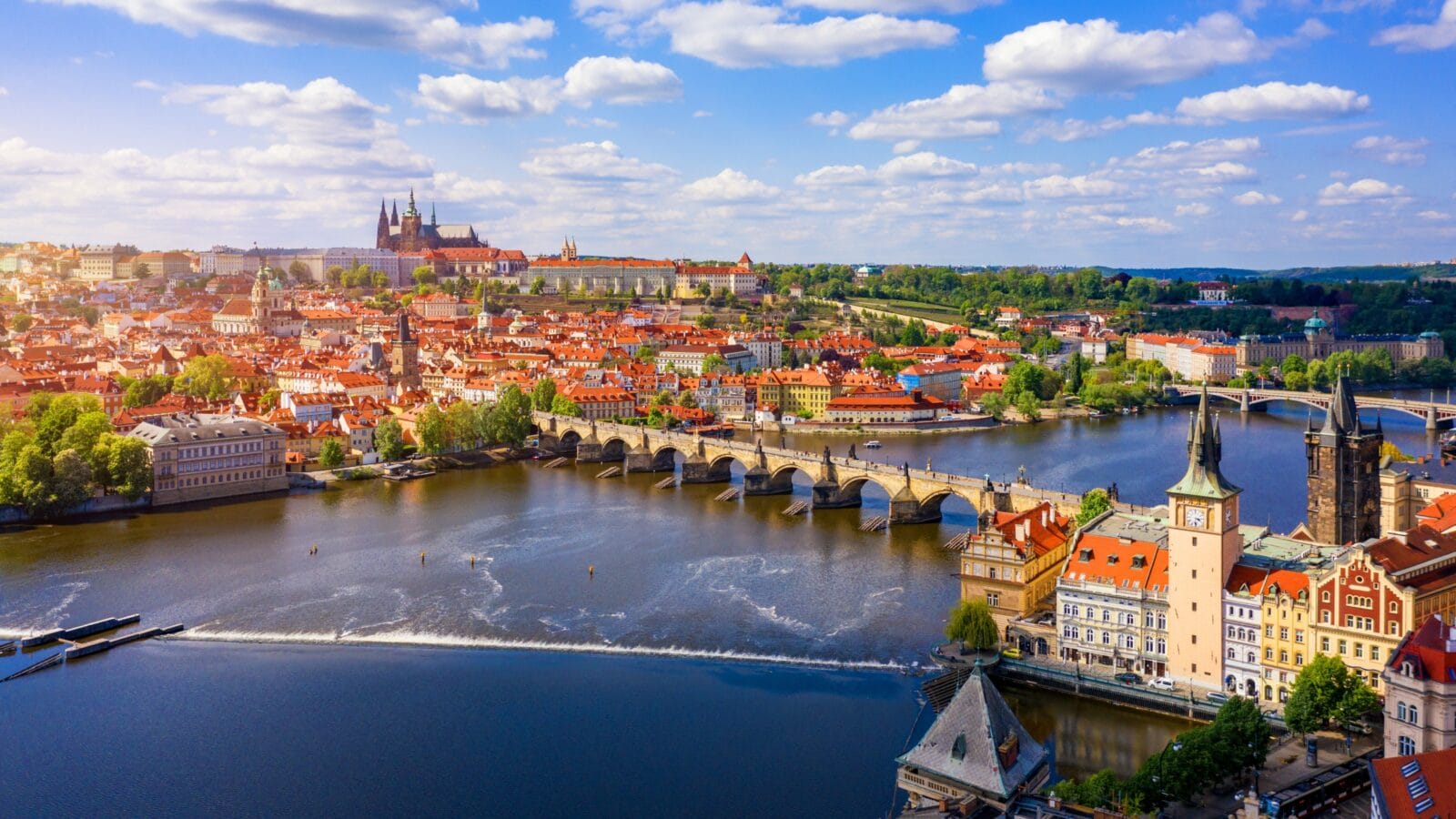 Scenic view of the Old Town pier architecture and Charles Bridge over Vltava river in Prague, Czech Republic.