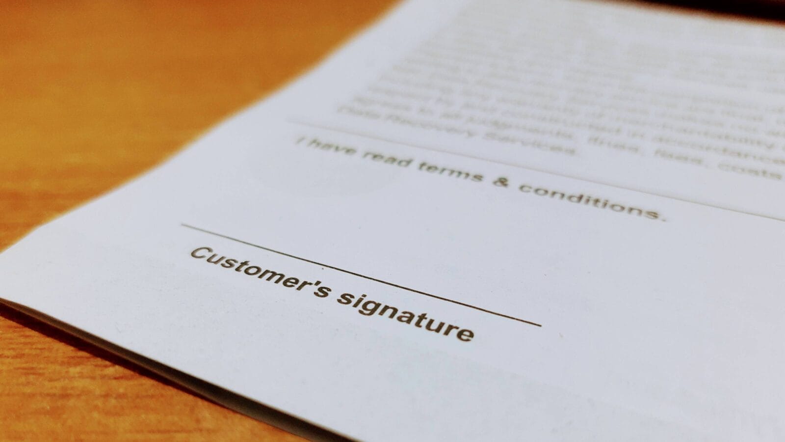 "Customer's signature" written\printed on a white paper with declaration of "I have read terms and conditions"