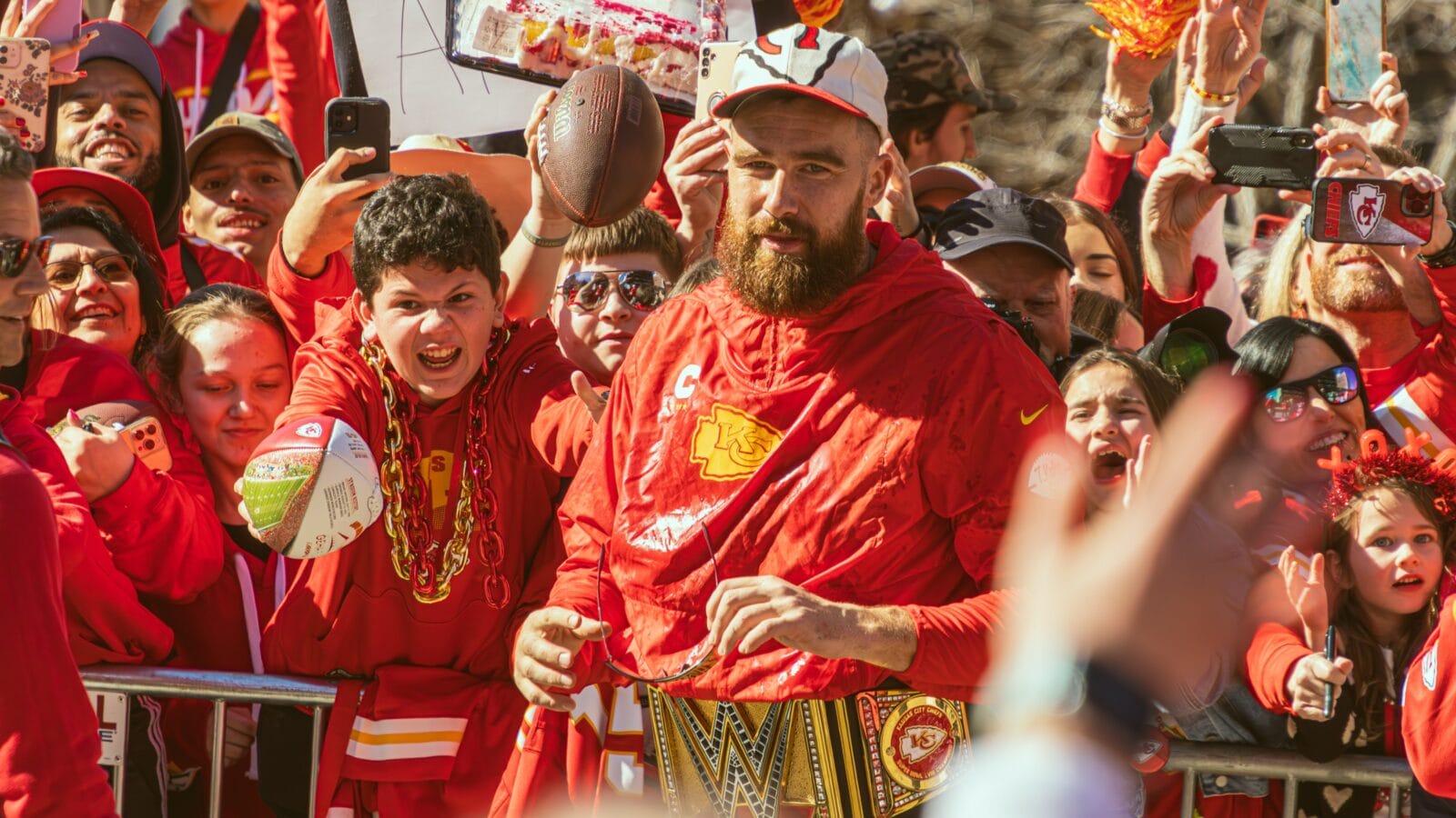 Travis Kelce interacts with many fans during the Super Bowl LVIII Parade