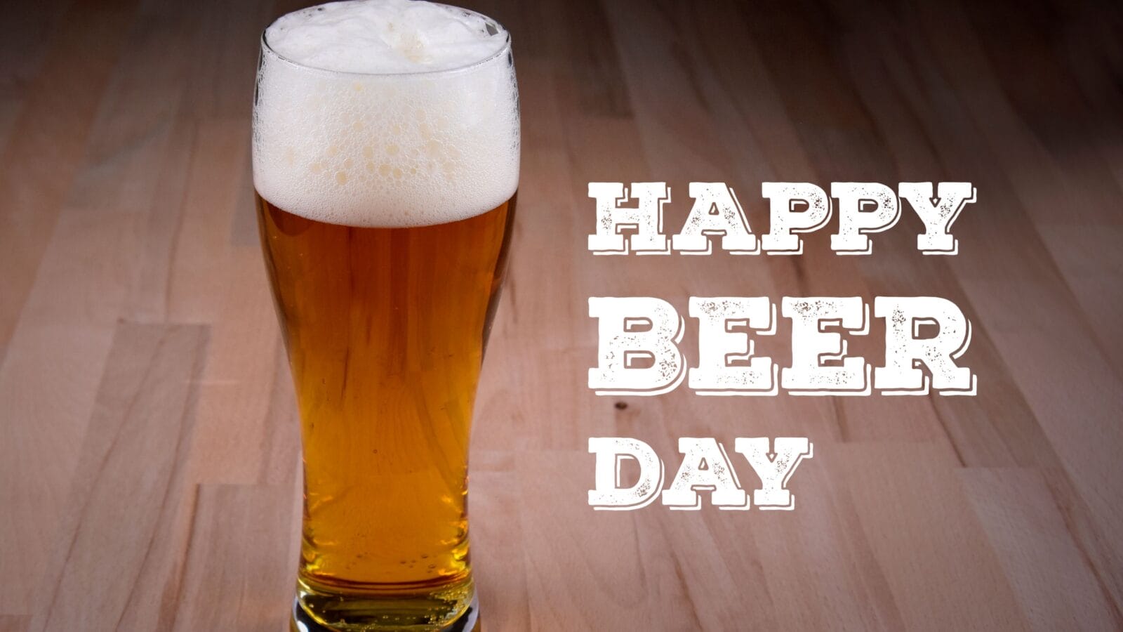 Happy Beer Day Poster. Full glass of beer on the table images. Fresh lager on a wooden background. Important day