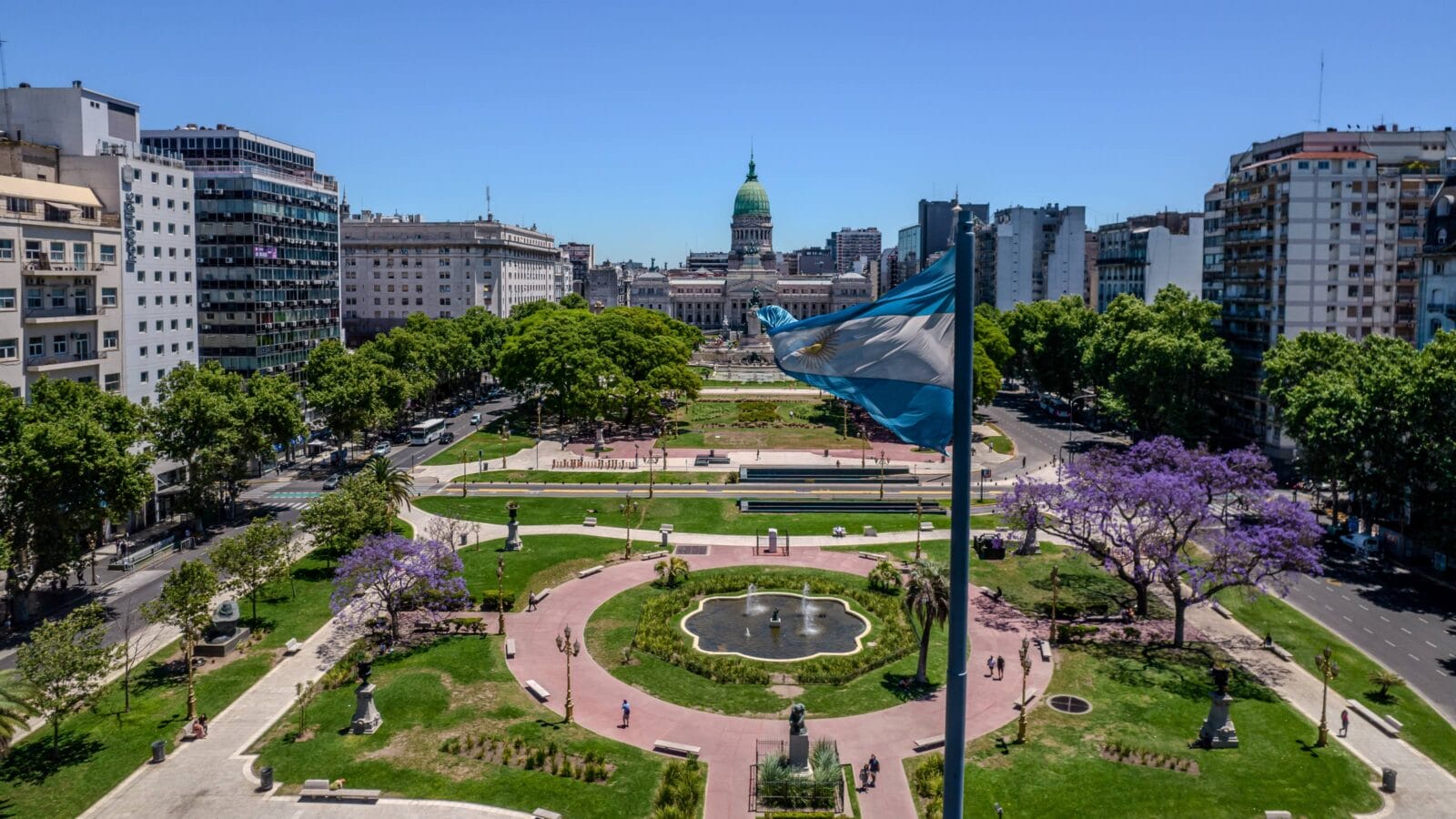 Beautiful aerial view of the Argentina flag waving, the Palace of the Argentine National Congress, in the city of Buenos Aires, Argentina