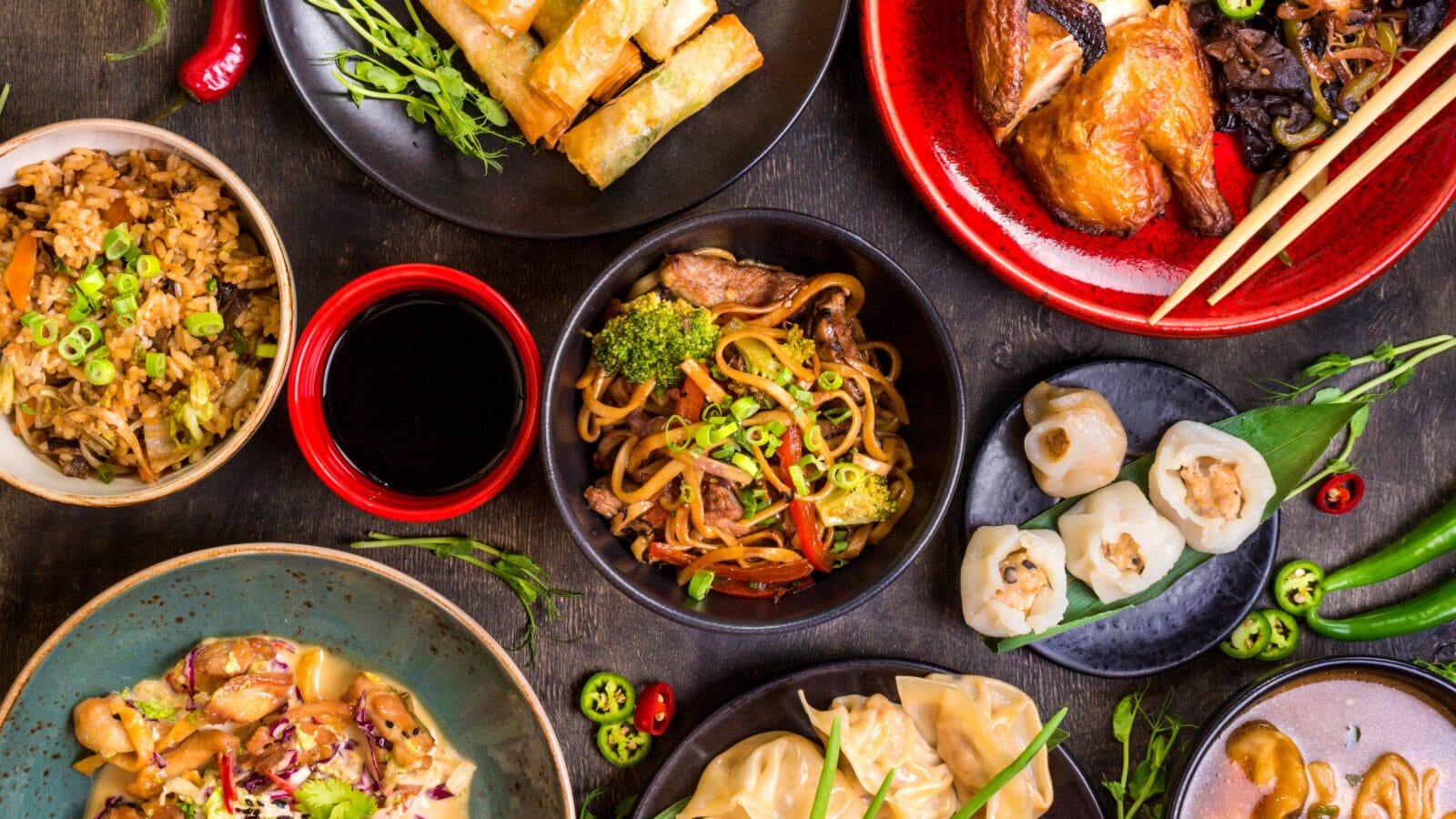 Assorted Chinese food set. Chinese noodles, fried rice, dumplings, peking duck, dim sum, spring rolls.