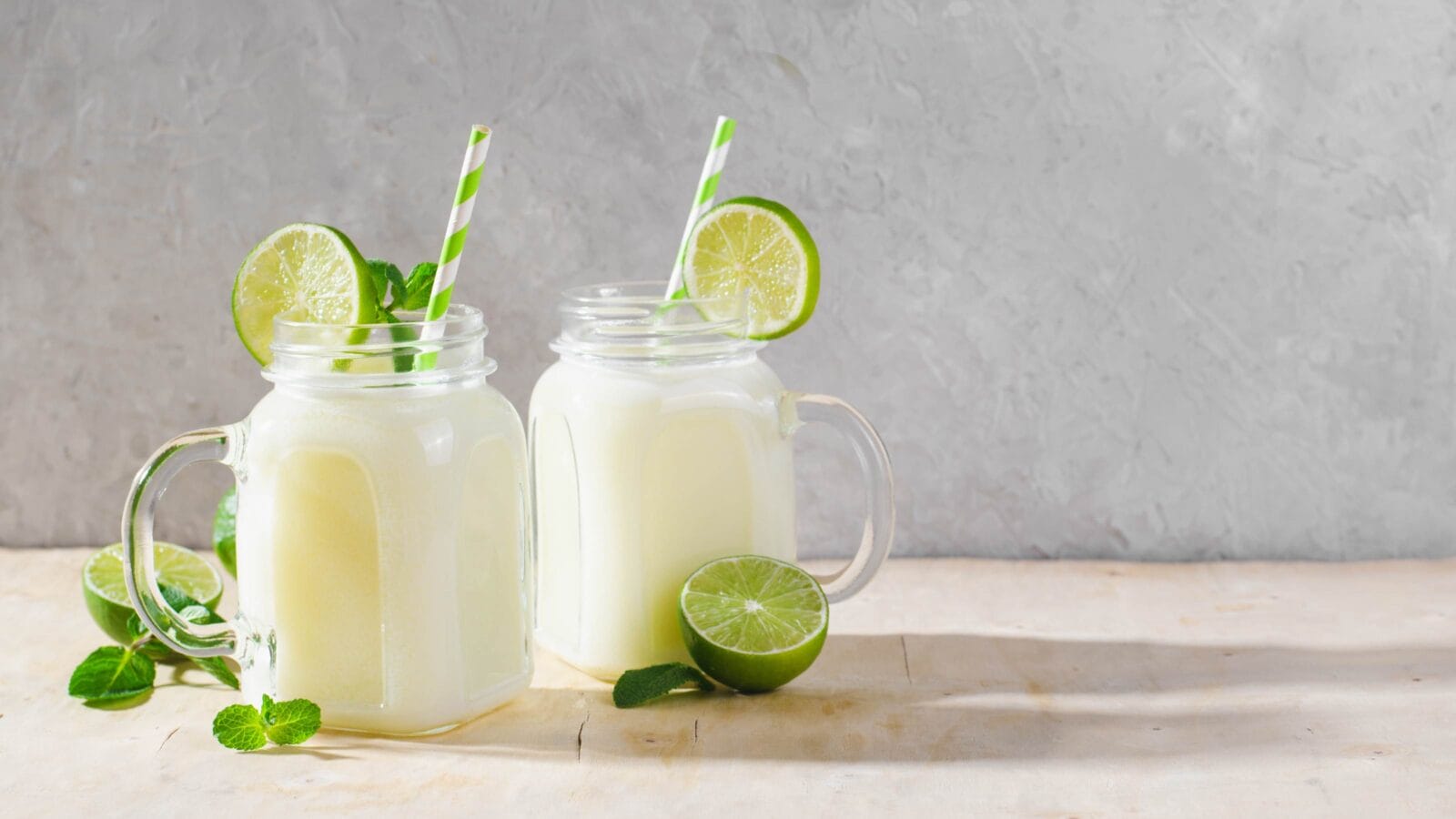 Brazilian Lemonade, Refreshing Creamy Lemonade or Limeade with Lime Slices and Mint