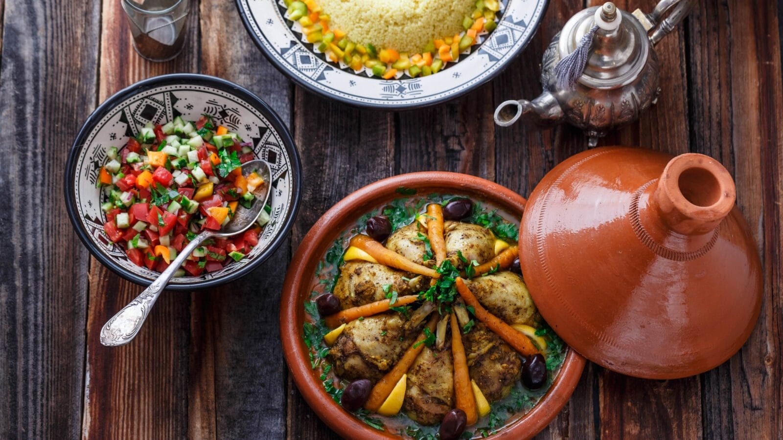 Slow cooked chicken with carrots, morrocan tajine, rustic style