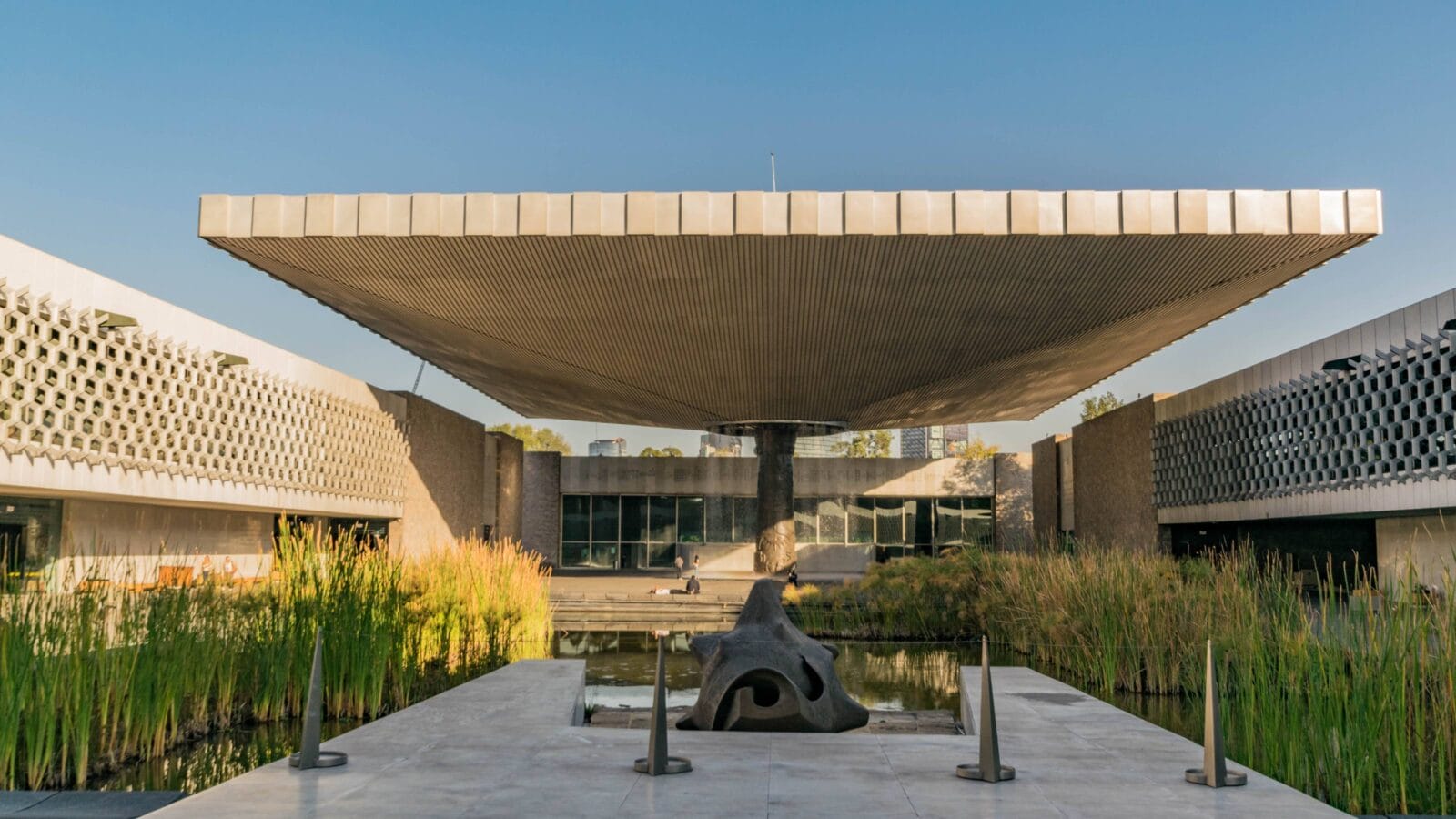 The courtyard inside the Anthropology Museum, with sculpture, pond and modern architecture