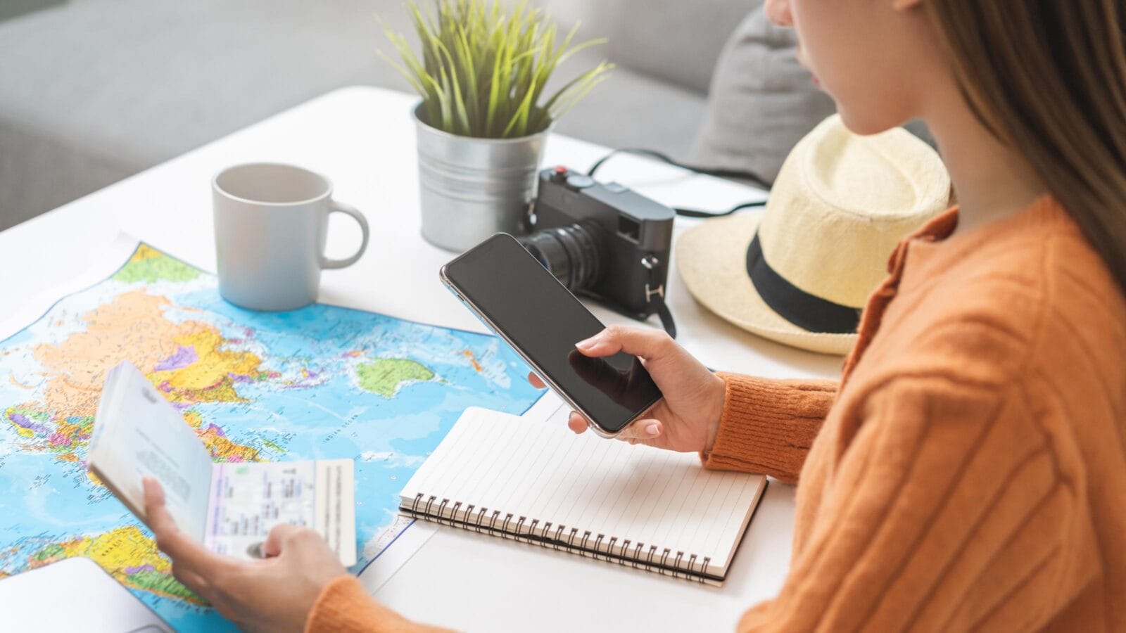 Travel planning, vacation, holiday trip, asian young tourist woman, girl hand using mobile phone, cellphone book flight ticket or check in online with passport