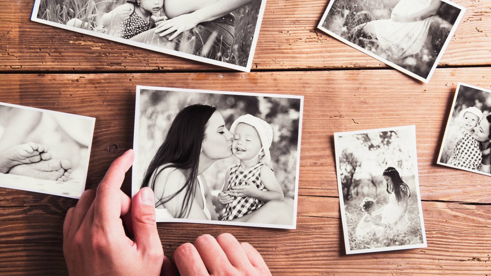 Mothers day composition. Black-and-white pictures, wooden background